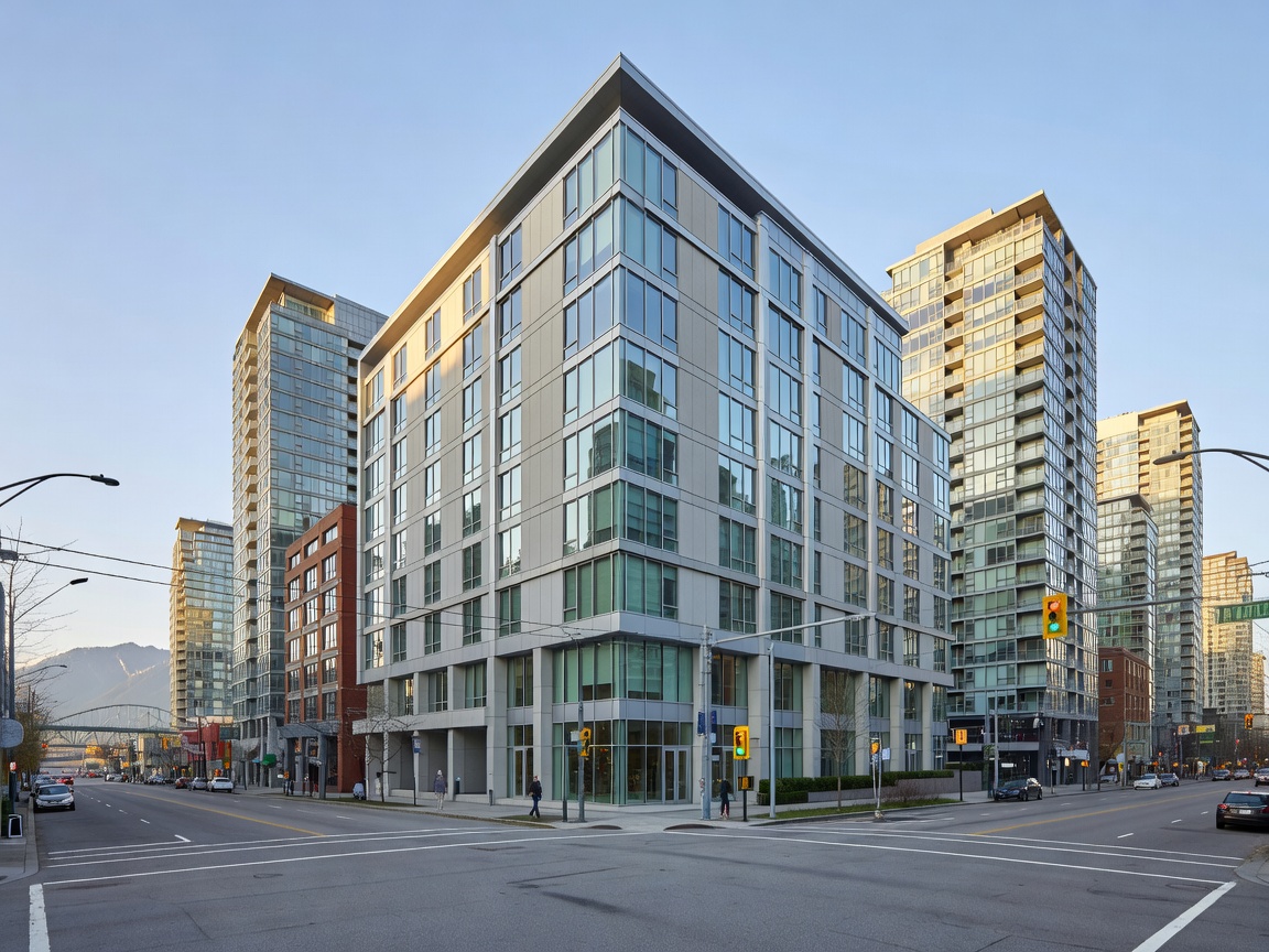 Modern hotel exterior in downtown Vancouver surrounded by city infrastructure